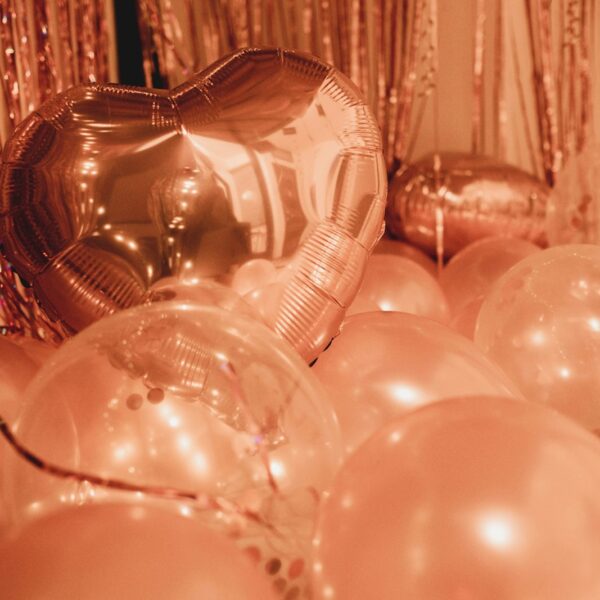 clear glass ball decors on brown wooden table